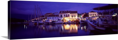 Greece, Cephalonia, Light illuminated on harbor and outdoors cafe