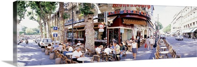 Group of people at a sidewalk cafe Paris France