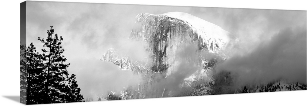 Low Angle View Of A Mountain Covered With Snow, Half Dome, Yosemite National Park, California, USA.