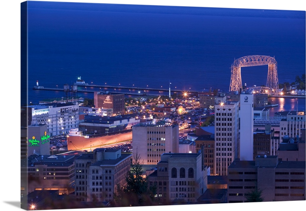 This wall art for the office or home is an aerial photograph of city harbor at night.