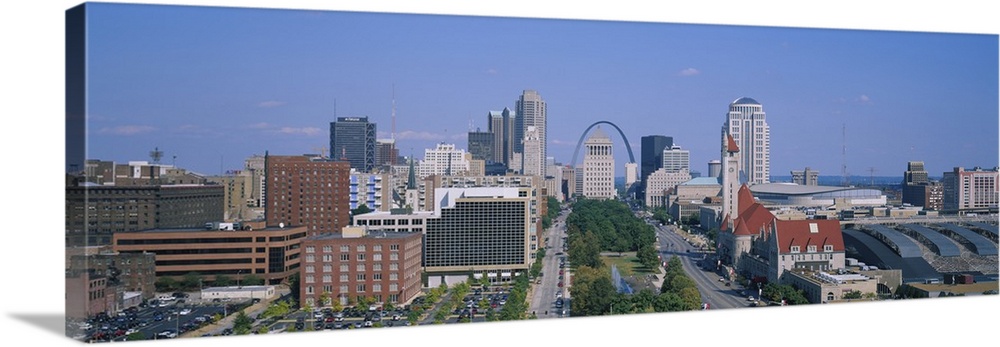 Panoramic, high angle photograph of the St. Louis skyline during the day, the Gateway Arch can be seen in the background, ...