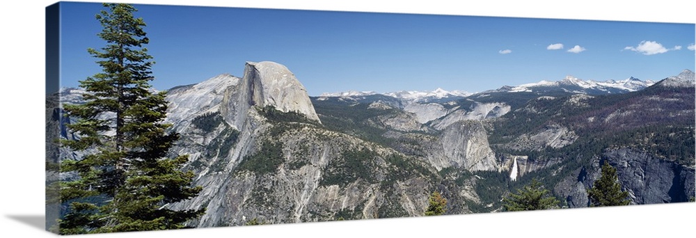 Long and horizontal canvas photo of the Half Dome mountain in Yellowstone with mountains surrounding it.