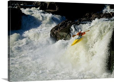 High angle view of a person kayaking in rapid water