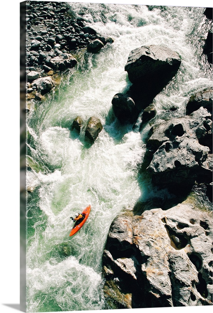 High angle view of a person kayaking in rapid water