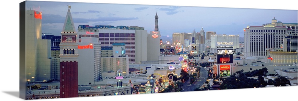 Panoramic photograph taken of part of the strip in Las Vegas during dusk.