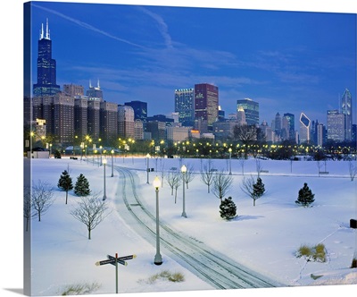 High angle view of snow covered landscape with buildings in the background, Chicago, Illinois