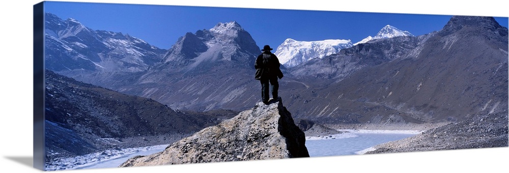 Hiker standing on a rock, Gokyo Valley, Khumbu, Nepal