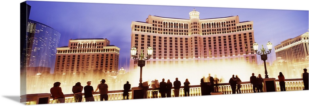 Large horizontal panoramic photograph of the Bellagio Resort and Casino lit up on the Las Vegas, Nevada (NV) Strip.