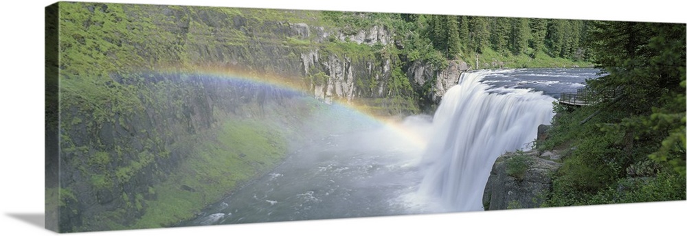 Idaho, Targhee National Forest, Upper Mesa Falls, Aerial view of a rainbow over a waterfall