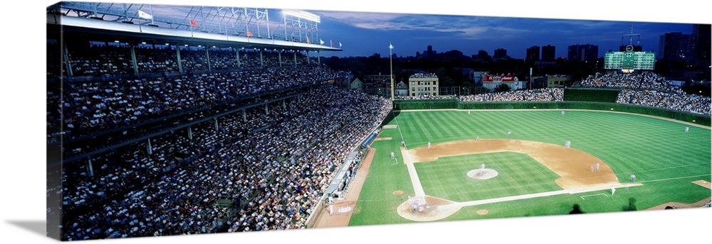 Panoramic photograph taken from the top section behind home plate overlooking historic Wrigley Field.  Over the ivy covere...
