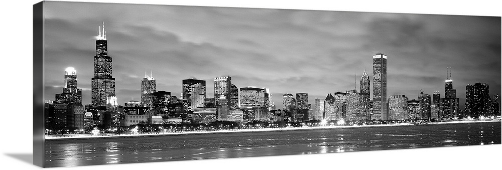 Black and White panoramic photograph showing the view from Lake Michigan in winter of the Chicago skyline of the downtown ...