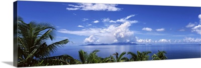 Indian ocean with palm trees towards Mahe Island, Seychelles