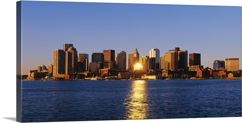 Giant photograph displays the distant skyline of a busy city in the Northeastern United States.  The brightly shining sun ...