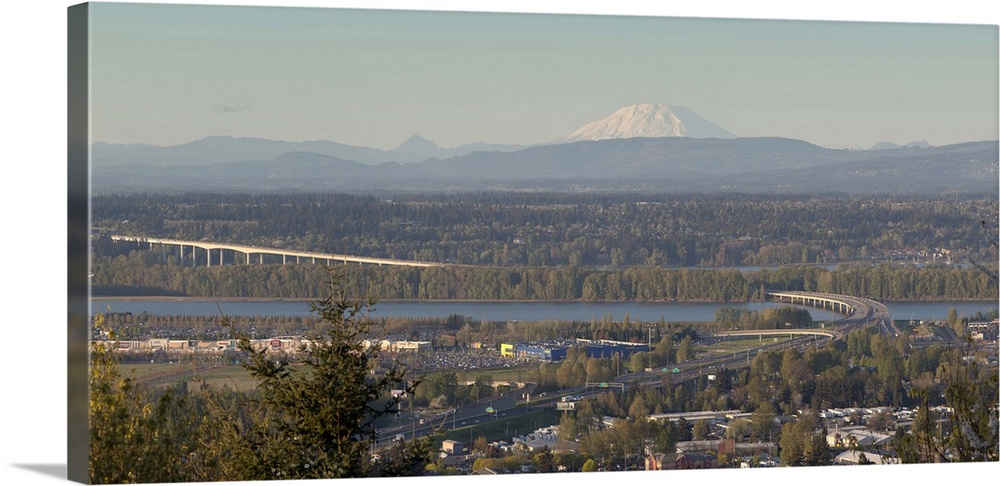 Elevated view of Interstate 205 Bridge over Columbia River with Mount St. Helens and business plaza, Portland, Oregon, USA.