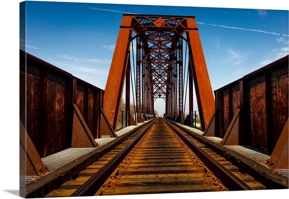 Iron railroad bridge over water, texas.