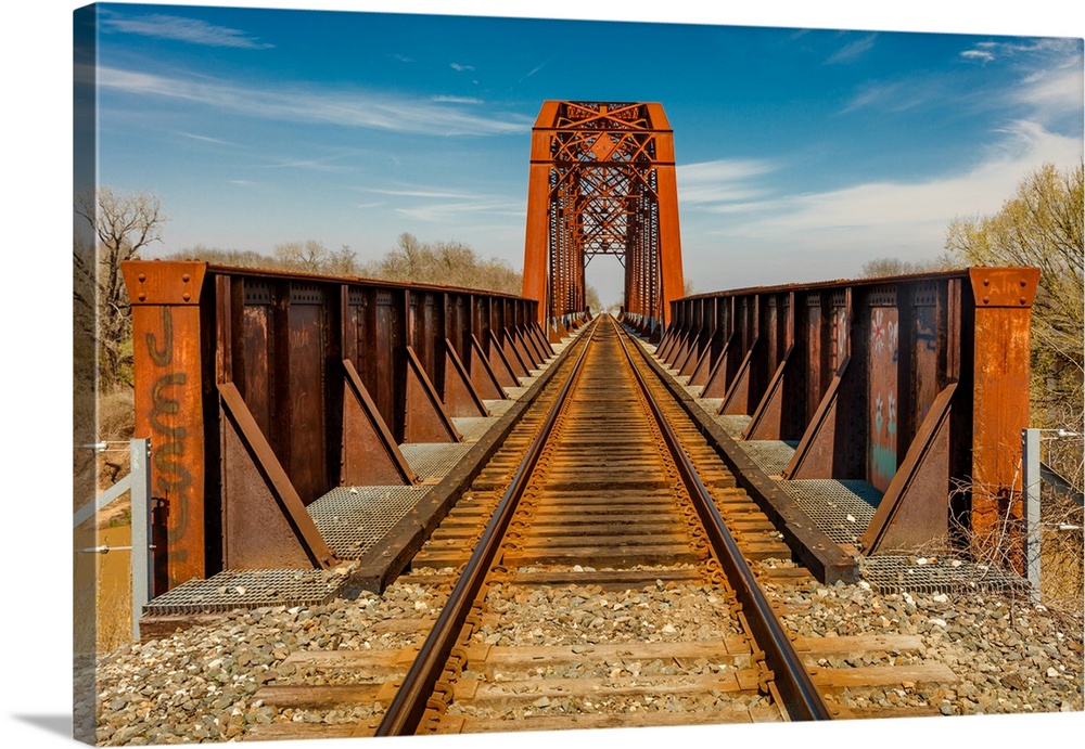 Iron railroad bridge over water, texas.