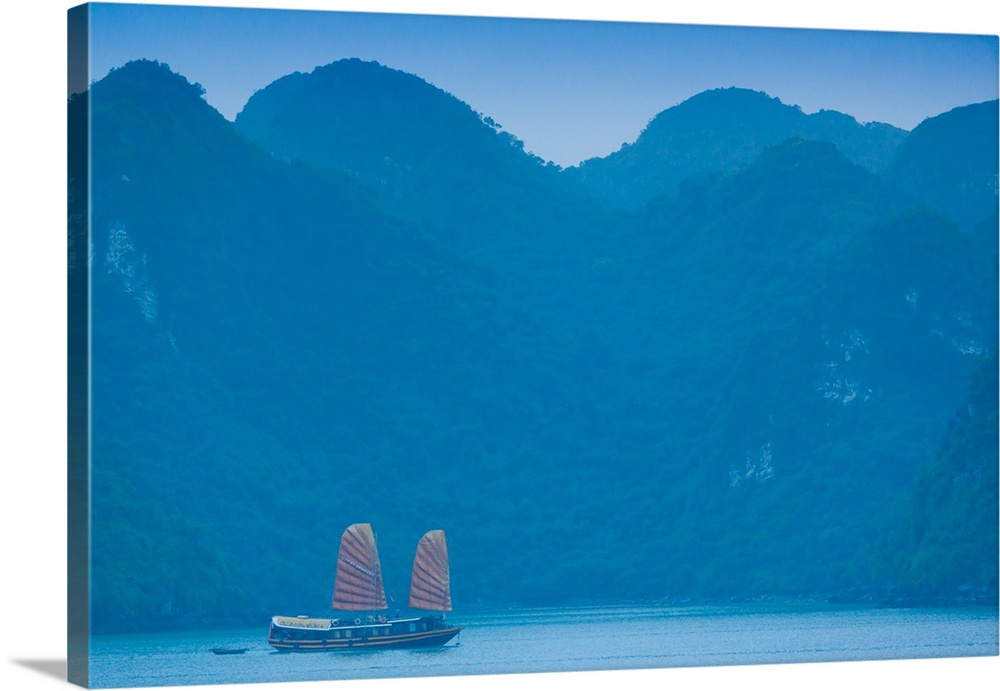 Islands and boat in the pacific ocean, ha long bay, quang ninh province, vietnam.