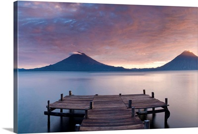Jetty in a lake with a mountain range in the background, Santa Cruz La Laguna, Guatemala