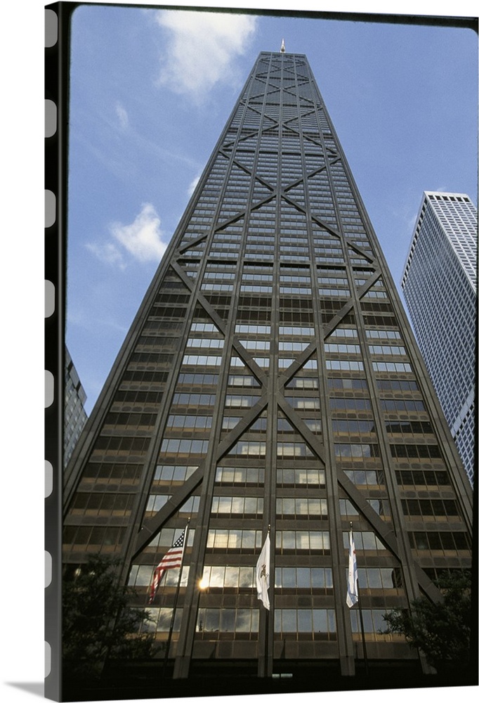 Vertical photograph from below of the Hancock building during the day in Chicago, Illinois.