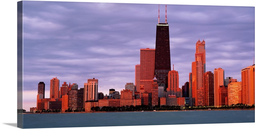 This landscape wall art captures the city skyline from the lake in the fading sunlight of the evening.