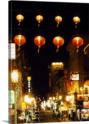 Lanterns hanging across a street, Grant Street, Chinatown, San Francisco, California