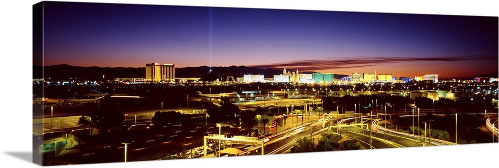 Las Vegas buildings illuminated at sunset.