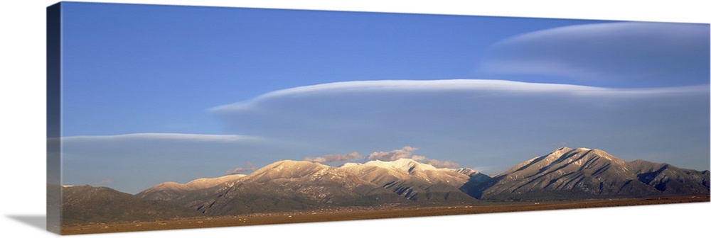 Lenticular clouds over a mountain range Taos Mountains Sangre de Cristo Range New Mexico