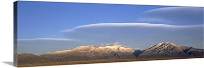 Lenticular clouds over a mountain range Taos Mountains Sangre de Cristo Range New Mexico