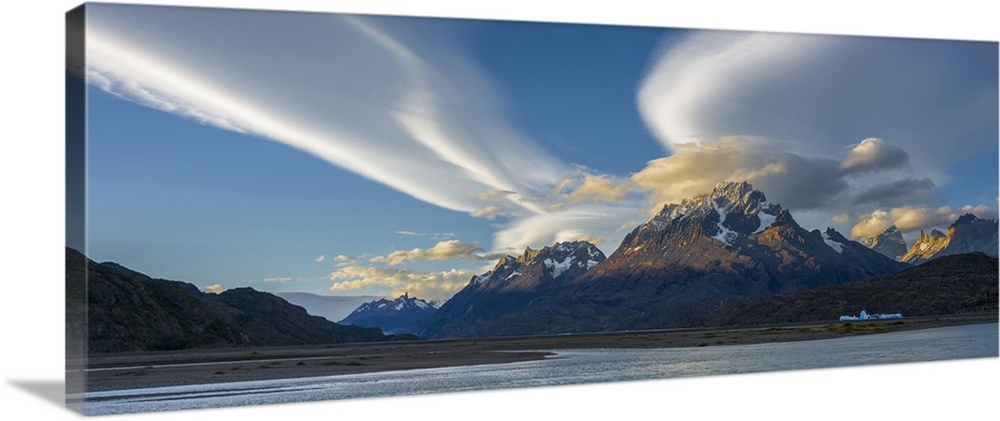 Lenticular clouds over mountain peaks, Grey Lake, Torres Del Paine National Park, Chile.