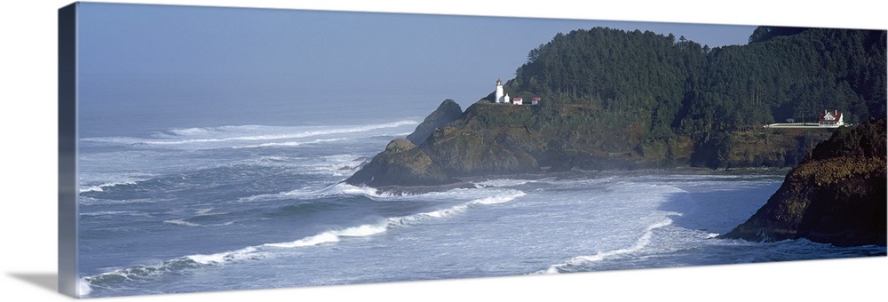 Large, landscape photograph of waves rushing against the shore in Heceta Head, Lane County, Oregon, the Heceta Head Lighth...