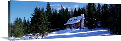Log House in Winter Laurentides Quebec Canada