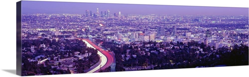 Wide angle, aerial photograph of the vast city of Los Angeles, California, beneath a clear sky.