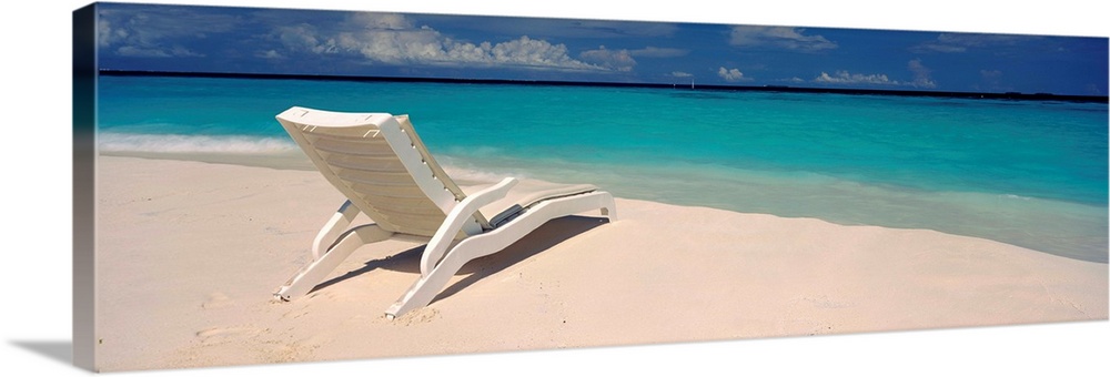 Lounge chair on the beach, Thulhagiri Island Resort, North Male Atoll, Maldives