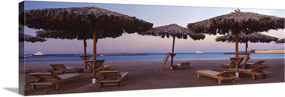 Lounge chairs with sunshades on the beach, Hilton Resort, Hurghada, Egypt