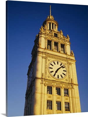 Low angle view of a clock tower, Wrigley Building, Chicago, Illinois