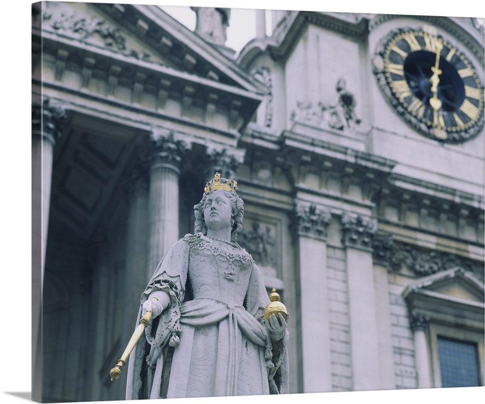 Low angle view of a statue in front of a cathedral, St. Pauls Cathedral, London, England