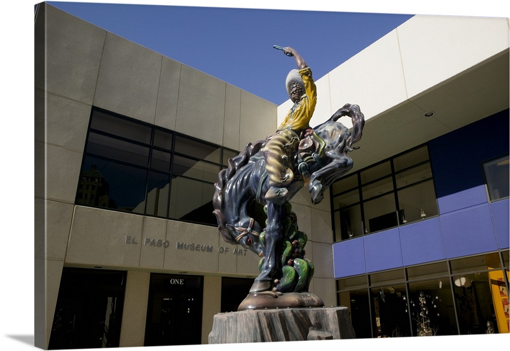 Low angle view of a statue of a cowboy on a bucking bronco in front of a museum, El Paso Museum Of Art, El Paso, Texas