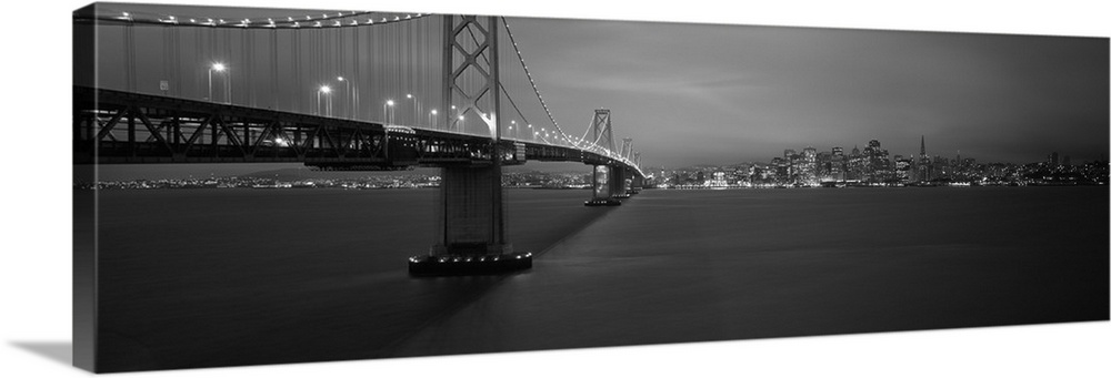 Low angle view of a suspension bridge lit up at night Bay Bridge San Francisco California