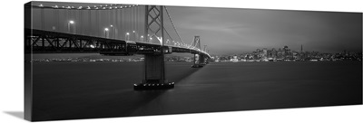 Low angle view of a suspension bridge lit up at night Bay Bridge San Francisco California