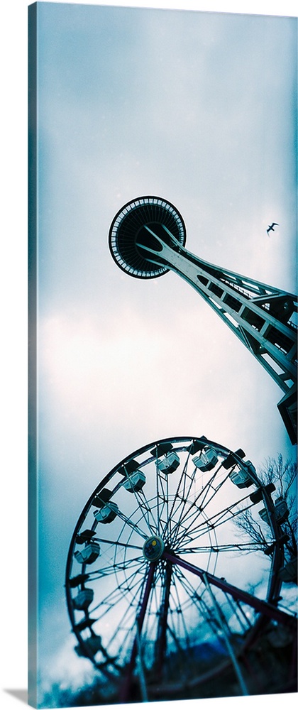 Low angle view of a tower and a ferris wheel, Space Needle, Seattle Center, Queen Anne Hill, Seattle, Washington State,