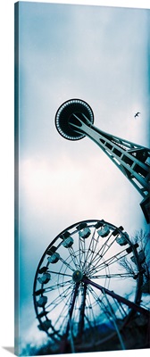 Low angle view of a tower and a ferris wheel, Space Needle, Seattle Center, Queen Anne Hill, Seattle, Washington State,