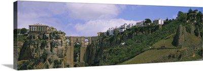 Low angle view of a town, Tajo Bridge, Rio Guadalevin Gorge, Serrania De Ronda, Ronda, Andalusia, Spain