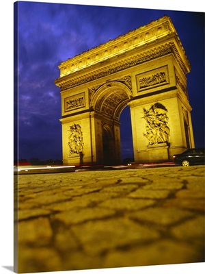 Low angle view of a triumphal arch, Arc De Triomphe, Paris, France