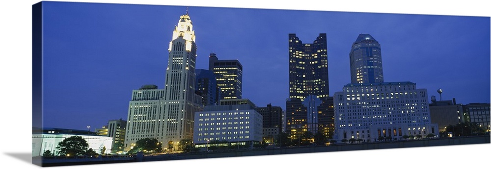 Low angle view of buildings lit up at night, Columbus, Ohio