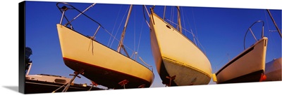 Low angle view of sailboats in dry dock, Boston Harbor, Boston, Massachusetts
