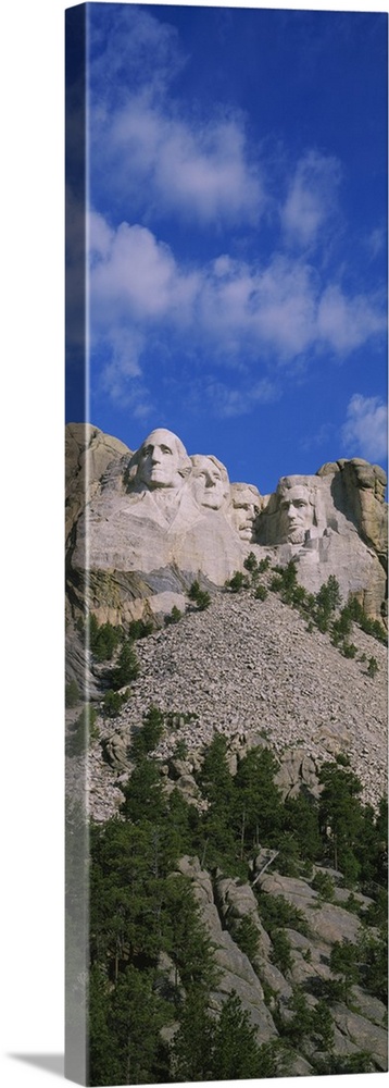 Low angle view of sculptures of US presidents carved on the rocks of a mountain, Mt Rushmore National Monument, South Dakota
