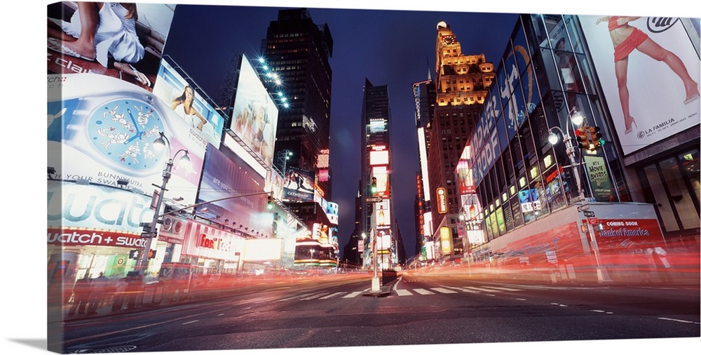 Low-angle panorama of the lights of Times Square in downtown New York City.