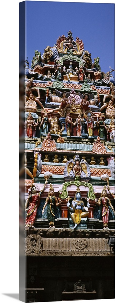 Low angle view of statues of Hindu gods on the roof of a temple, Arulmigu Kapaleeswarar Temple, Chennai, Tamil Nadu, India