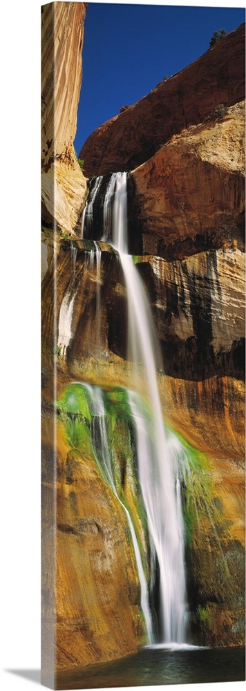 A vertical photograph taken with the time lapsed technique show the flow of the water down the rock face of this waterfall.