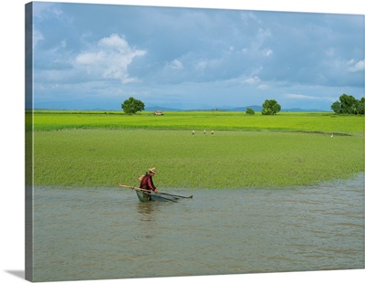 Man fishing at edge of Kaladan River, Rakhine State, Myanmar